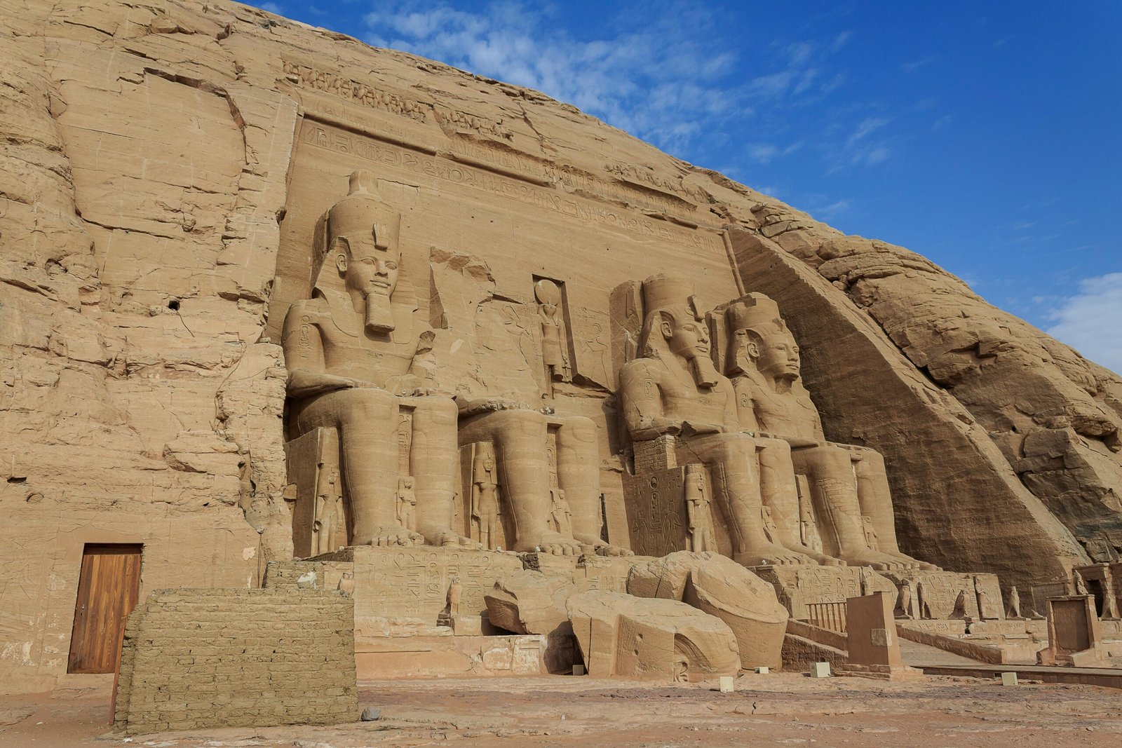 Majestic view of the Abu Simbel Temples carved into rock in Egypt, showcasing ancient Egyptian architecture.